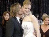 Singer Keith Urban (L) kisses his wife Nicole Kidman, nominated for best actress in a leading role for "Rabbit Hole". PHOTO: REUTERS